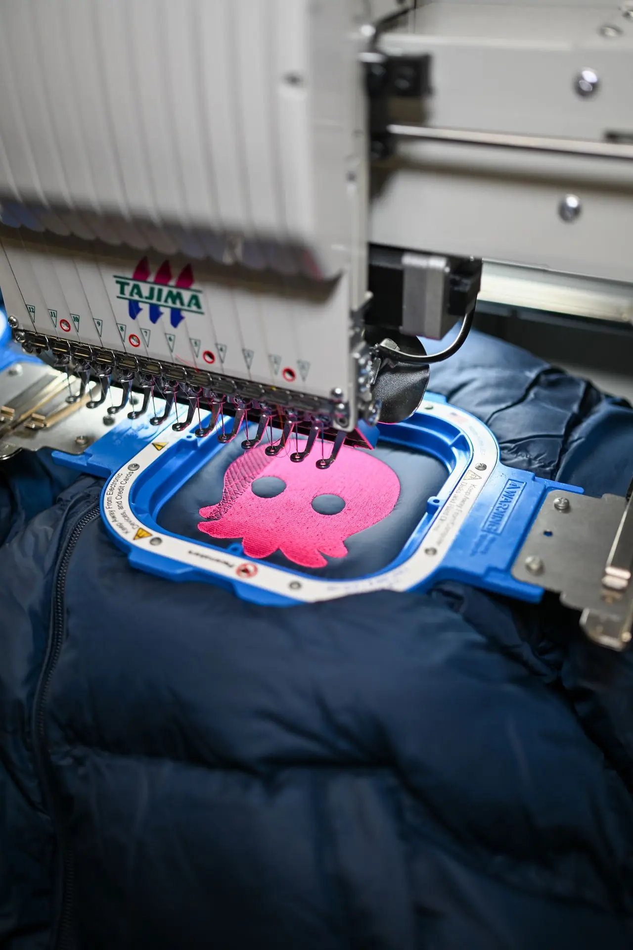 Pufferjacke Bestickung Octopus Energy